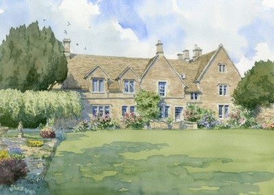 Cotswold stone house with roses in garden